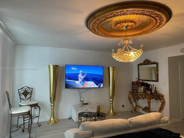 living room with a chandelier and a tray ceiling