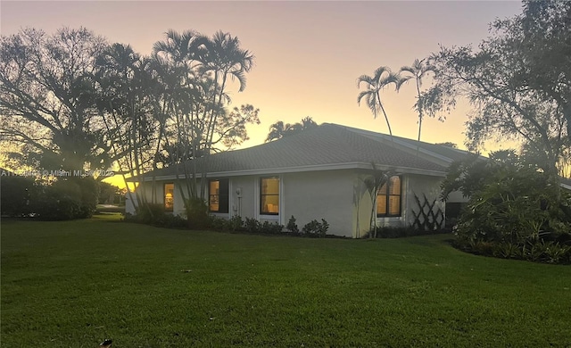 view of front of property with a lawn