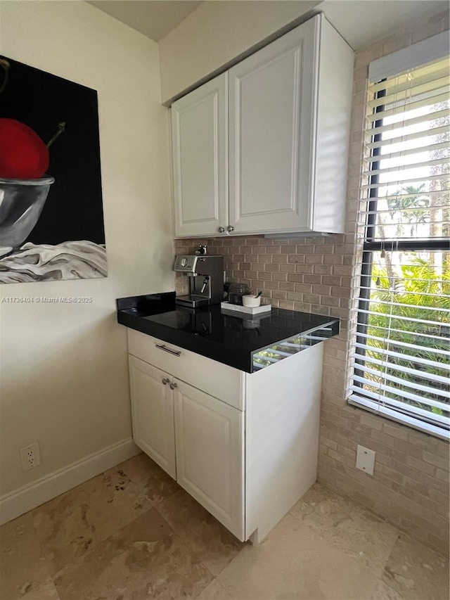 bar with white cabinetry