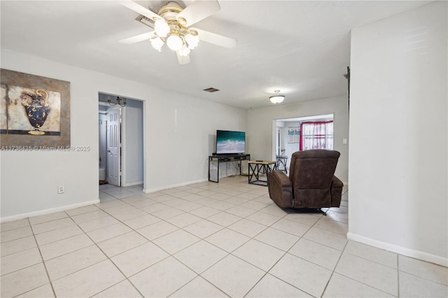 tiled living room featuring ceiling fan