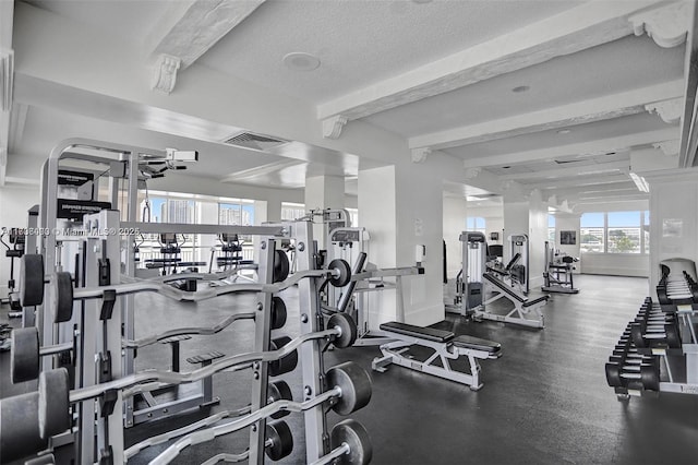 exercise room with a textured ceiling