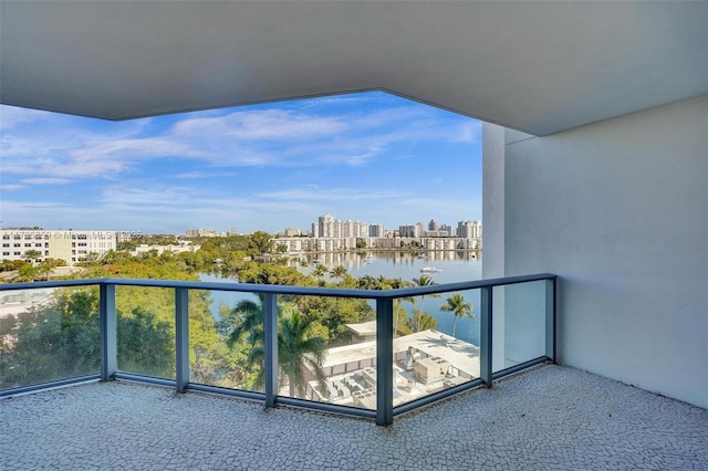 balcony featuring a water view