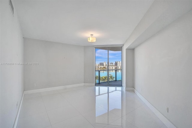 tiled empty room with expansive windows