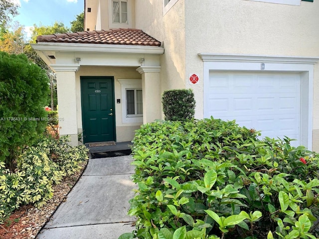 doorway to property featuring a garage