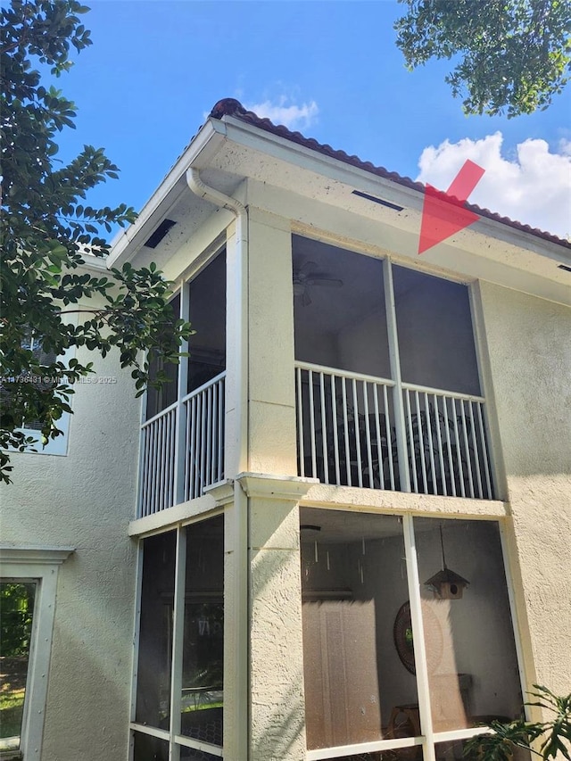 view of side of home with a balcony