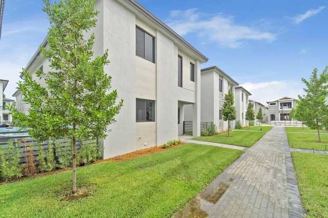 view of home's exterior featuring a lawn