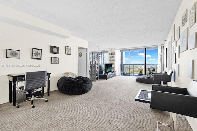 carpeted living room featuring floor to ceiling windows and a textured ceiling