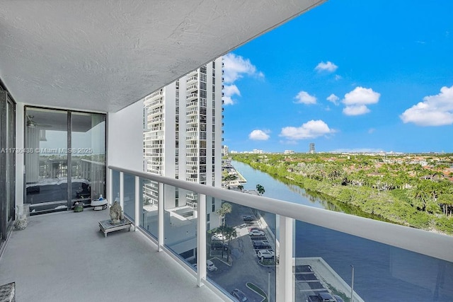 balcony featuring a water view