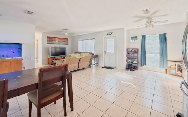 dining area featuring light tile patterned floors and ceiling fan