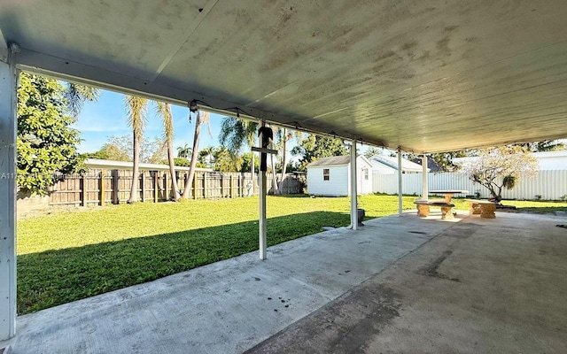 view of patio with a shed