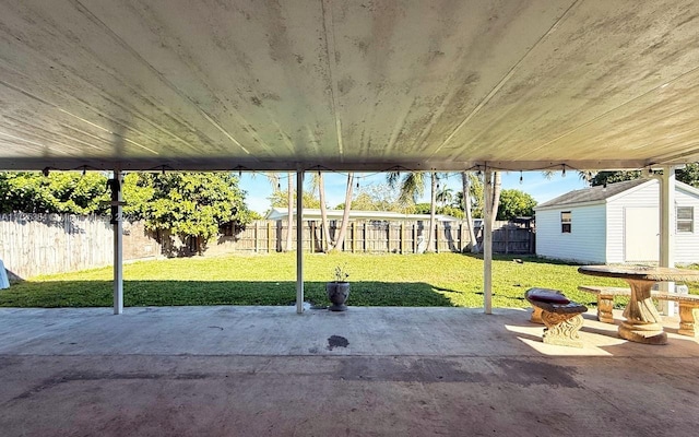 view of patio / terrace with a shed