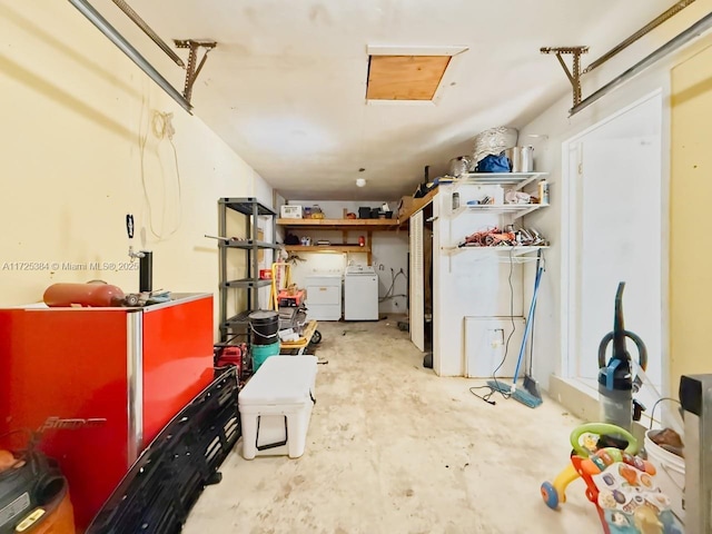 garage with washing machine and dryer