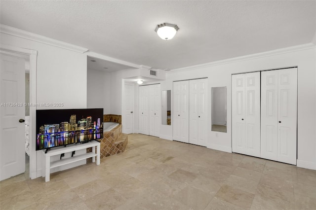 living room with crown molding and a textured ceiling