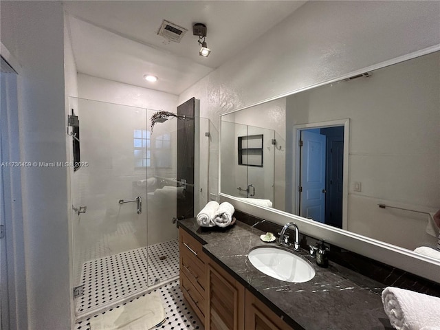 bathroom with vanity and walk in shower