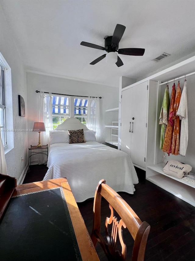 bedroom featuring dark hardwood / wood-style flooring and ceiling fan