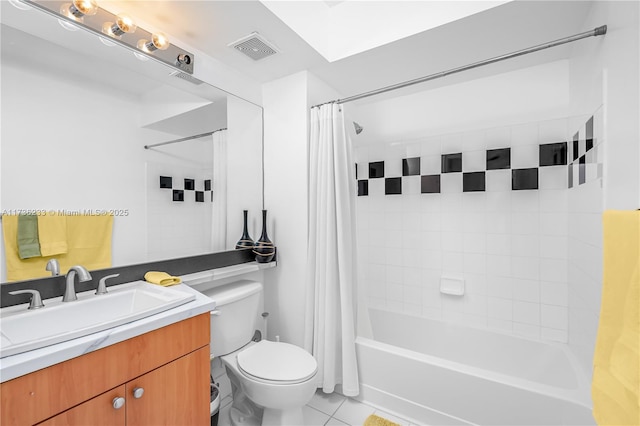 full bathroom featuring vanity, toilet, tile patterned flooring, and shower / tub combo