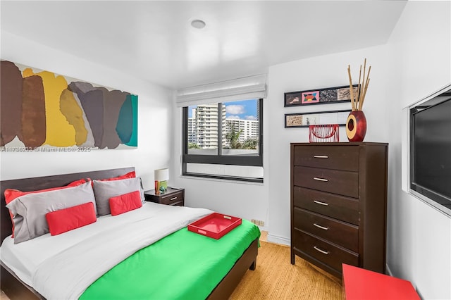 bedroom with light hardwood / wood-style flooring