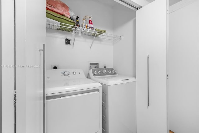 laundry room featuring washer and clothes dryer