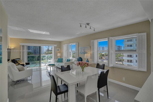 dining space featuring a textured ceiling