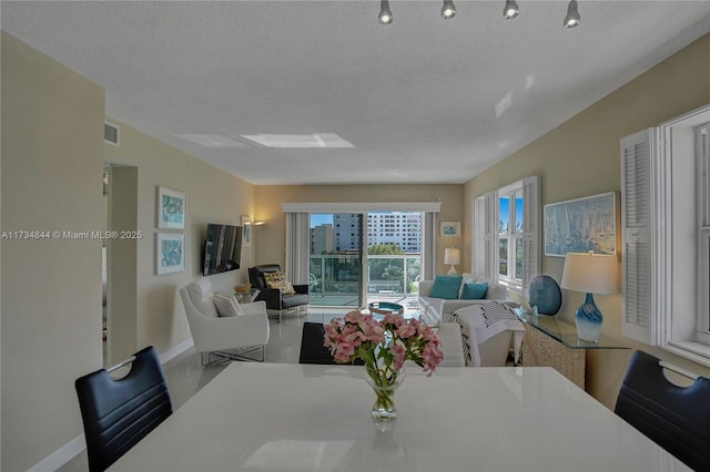 dining room with a textured ceiling