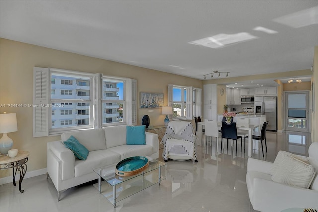 living room featuring rail lighting