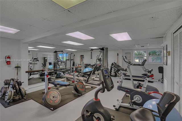 exercise room with a drop ceiling