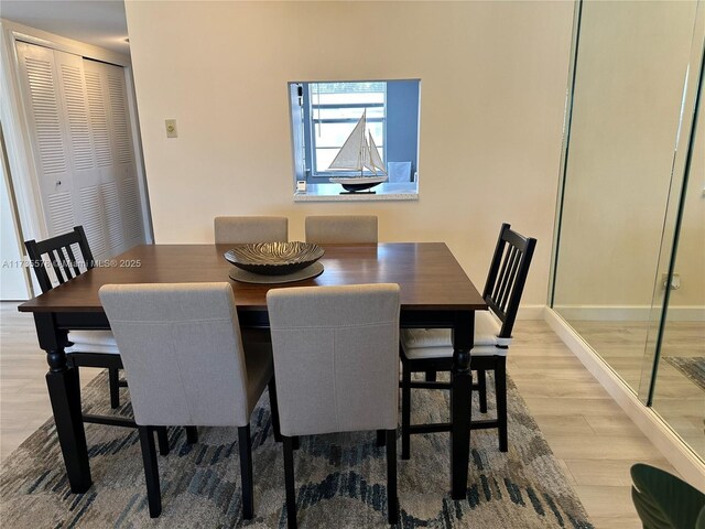 dining area with light hardwood / wood-style floors