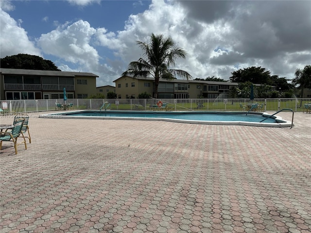 view of pool featuring a patio area