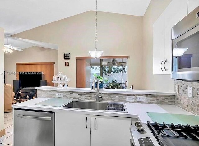 kitchen featuring appliances with stainless steel finishes, decorative light fixtures, white cabinetry, sink, and ceiling fan