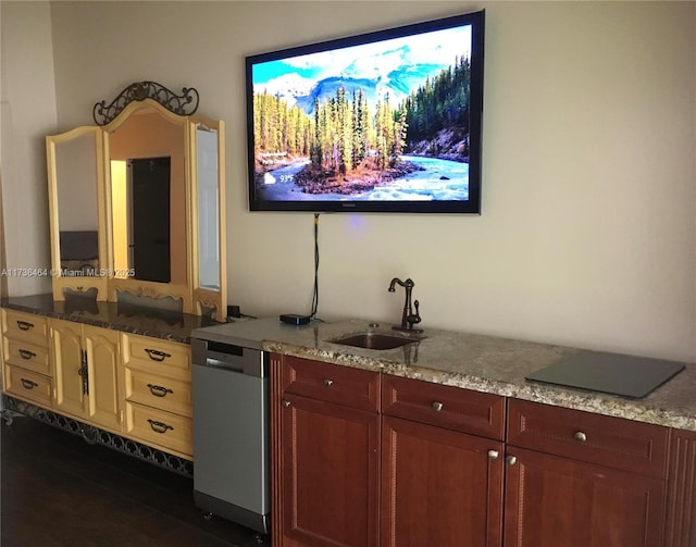 interior space with dark stone countertops, sink, dark hardwood / wood-style floors, and dishwasher