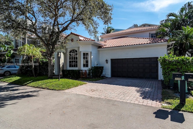 mediterranean / spanish house featuring a garage