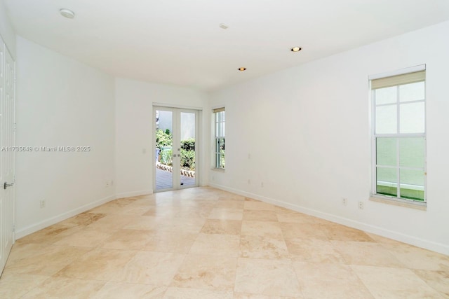 unfurnished room with french doors