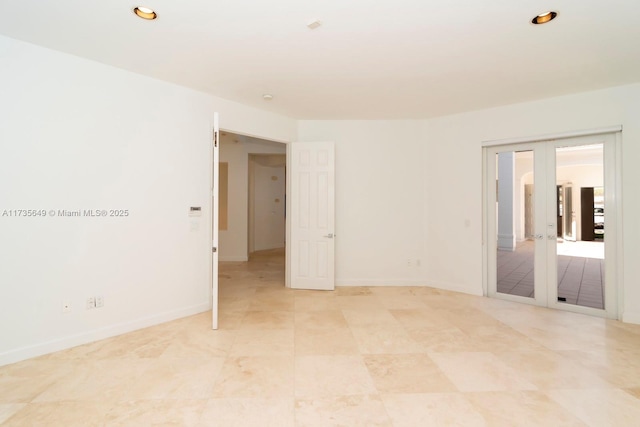 empty room featuring french doors