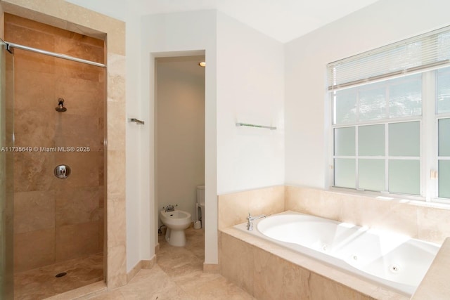 bathroom featuring a bidet, tile patterned flooring, and separate shower and tub