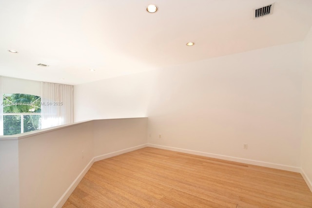 unfurnished room featuring light wood-type flooring