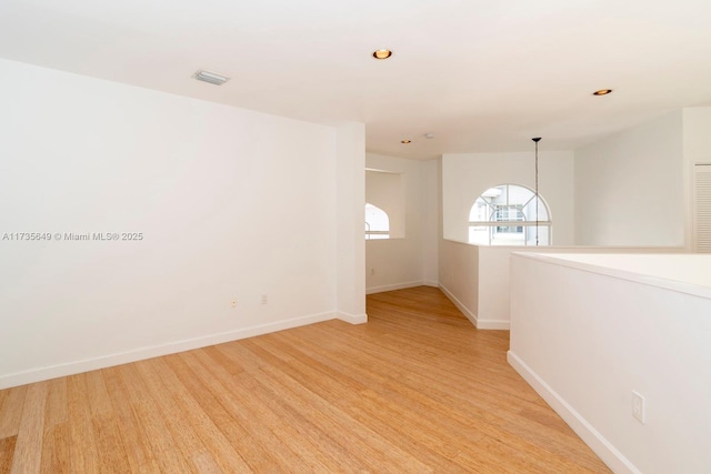 unfurnished room featuring light hardwood / wood-style floors