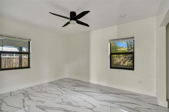 unfurnished room with ceiling fan