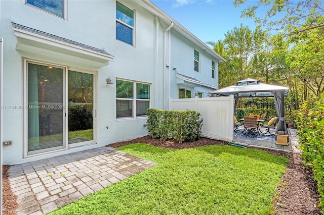 exterior space with a gazebo and a patio area