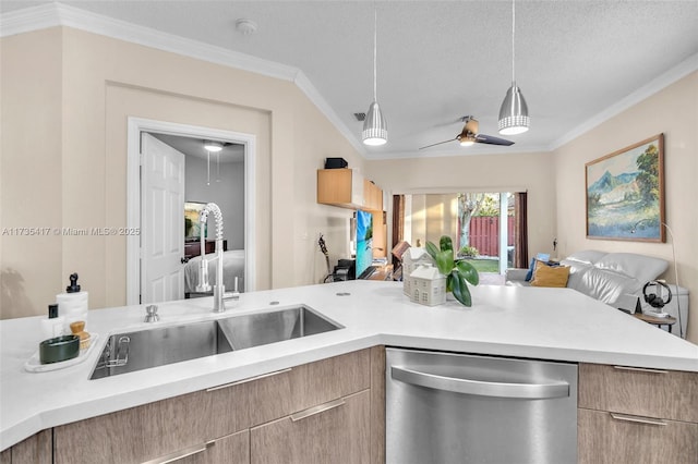 kitchen featuring decorative light fixtures, dishwasher, sink, ornamental molding, and a textured ceiling