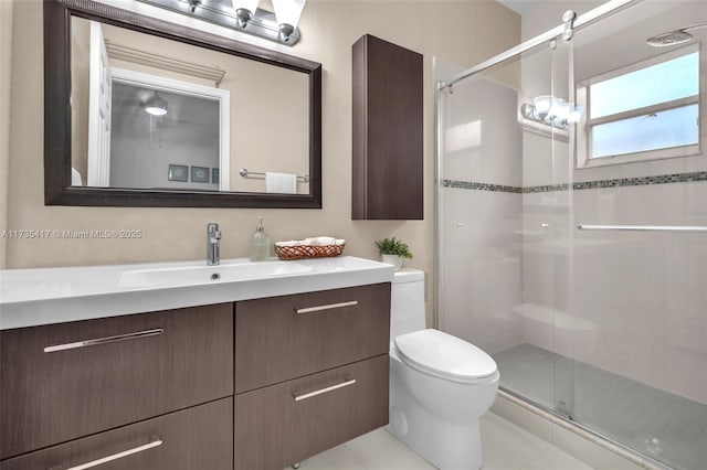 bathroom featuring vanity, an enclosed shower, tile patterned floors, and toilet