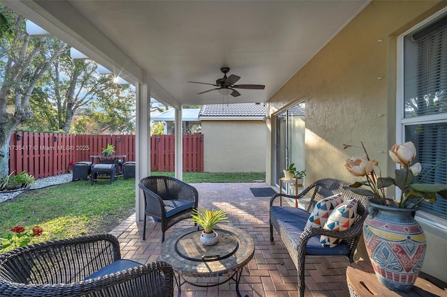 view of patio / terrace with ceiling fan and outdoor lounge area