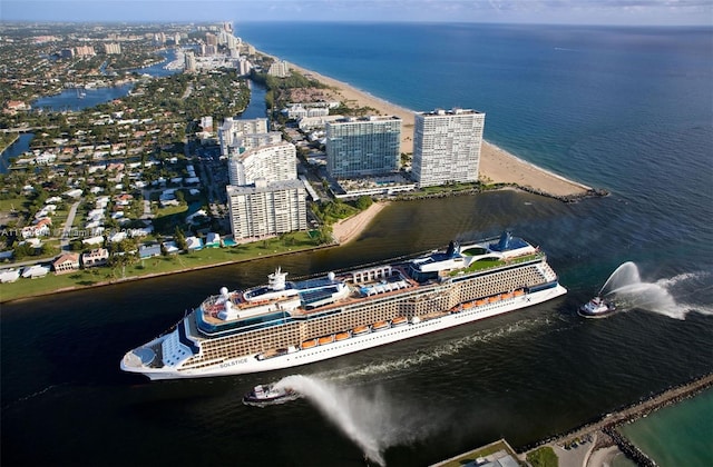 birds eye view of property with a water view