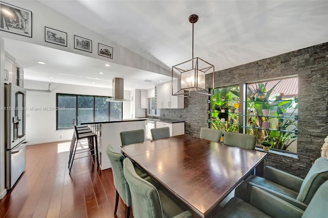 dining room featuring a notable chandelier and hardwood / wood-style flooring