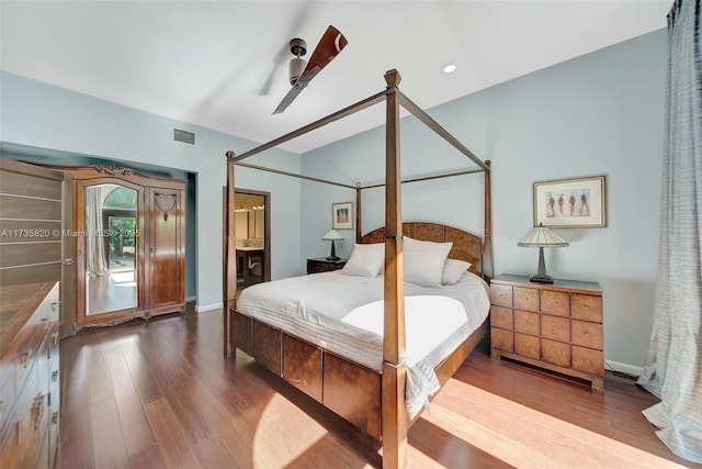 bedroom with hardwood / wood-style floors, ensuite bath, and ceiling fan