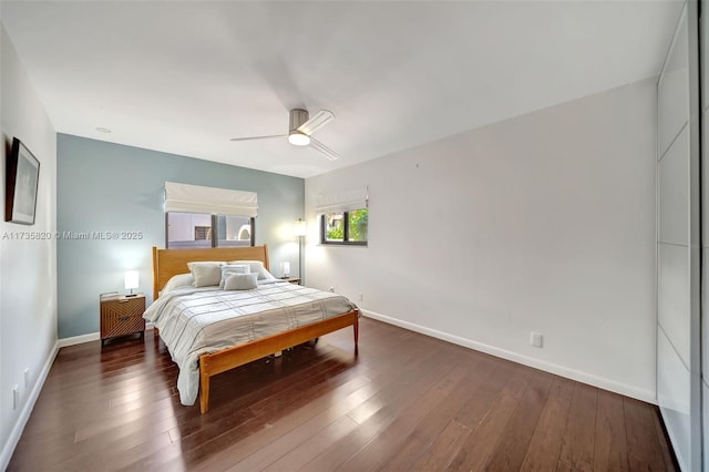 bedroom featuring ceiling fan and dark hardwood / wood-style floors