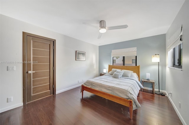 bedroom with dark hardwood / wood-style floors and ceiling fan