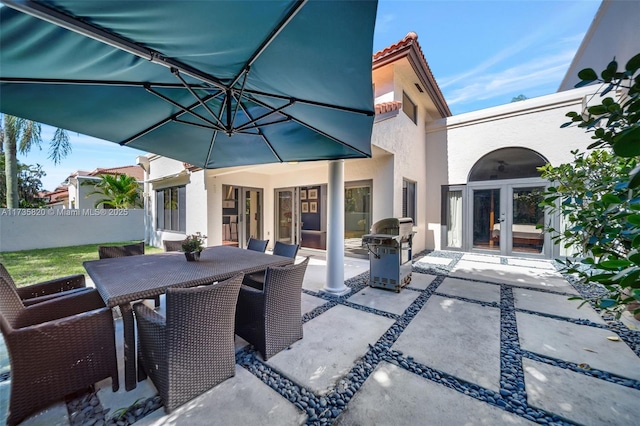 view of patio / terrace with a grill and french doors