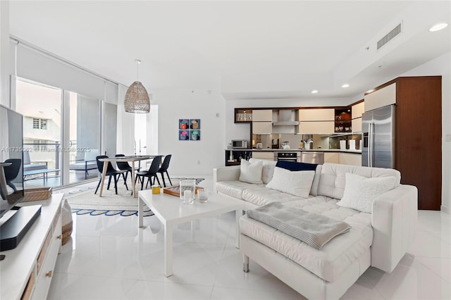 living room featuring light tile patterned flooring