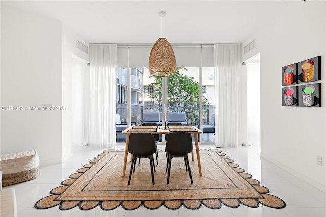 dining space with light tile patterned flooring