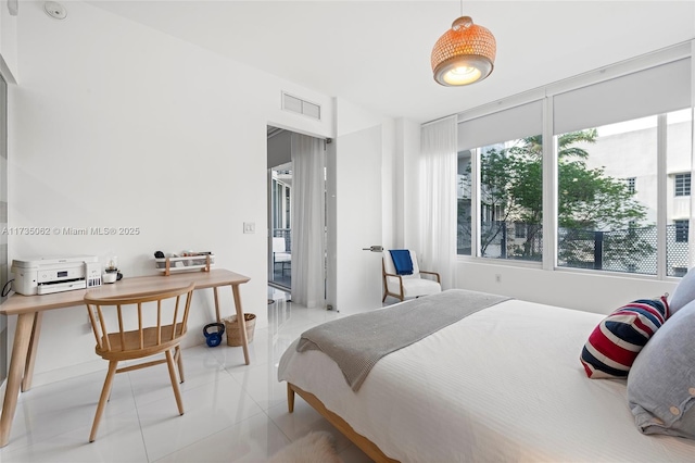 bedroom featuring light tile patterned floors